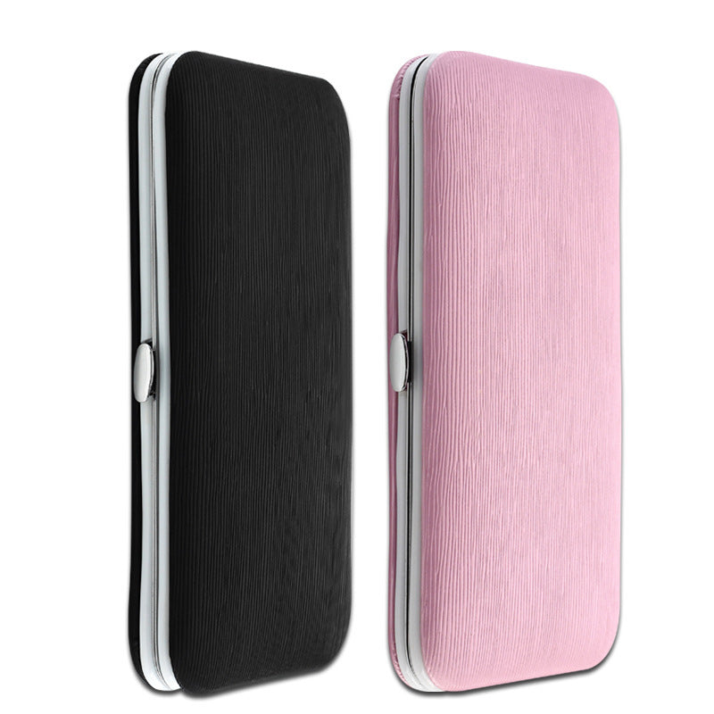 Stainless steel nail care tools in pink case
